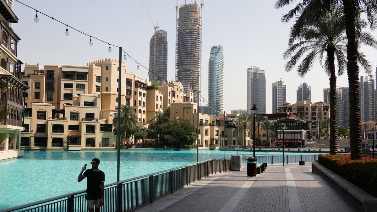 A person stands at a plaza near Burj Khalifa, after an Iranian attack, following the United States-Israeli strikes on Iran, Dubai, United Arab Emirates, March 1, 2026. (Reuters Photo)