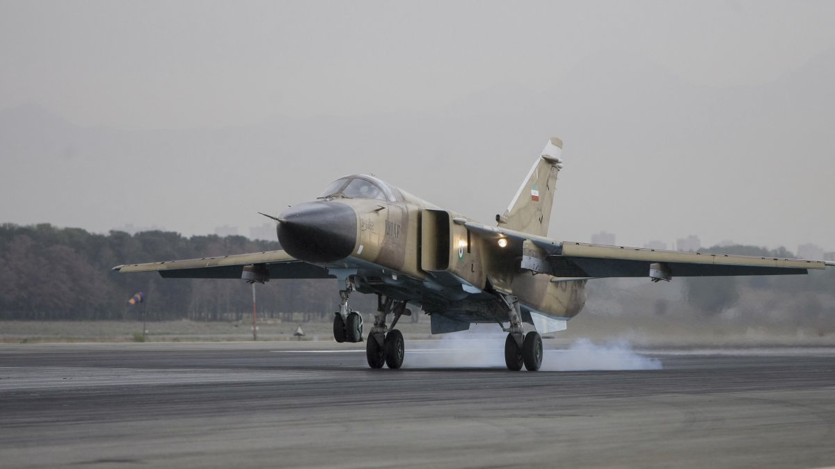 A Sukhoi Su-24M Fencer D aircraft lands on the runway during an Islamic Republic of Iran Air Force military drill at the Shahid Lashkari Tactical Air Base (TAB-1) in Tehran, Iran, on April 16, 2009. (Photo by Ali Rafiei / Middle East Images via AFP)