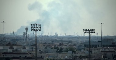 Smoke rises from an area in the direction of Al Udeid Air Base, which houses the Qatar Emiri Air Force and foreign forces, including the U.S., Doha, Qatar, Feb. 28, 2026. (AFP Photo)