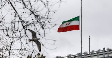 Iran's national flag is lowered to half‑mast at the Iranian Consulate after Iran's Supreme Leader Ayatollah Ali Khamenei was killed in joint Israeli-U.S. strikes, Istanbul, Türkiye, March 1, 2026. (Reuters Photo)
