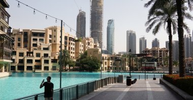 A person stands at a plaza near Burj Khalifa, after an Iranian attack, following the United States-Israeli strikes on Iran, Dubai, United Arab Emirates, March 1, 2026. (Reuters Photo)