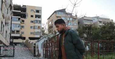 A man walks past a damaged building after an Israeli airstrike in the neighborhood of Haret Hreik, Beirut, Lebanon, March 2, 2026. (AFP Photo)
