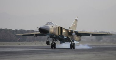 A Sukhoi Su-24M Fencer D aircraft lands on the runway during an Islamic Republic of Iran Air Force military drill at the Shahid Lashkari Tactical Air Base (TAB-1) in Tehran, Iran, on April 16, 2009. (Photo by Ali Rafiei / Middle East Images via AFP)