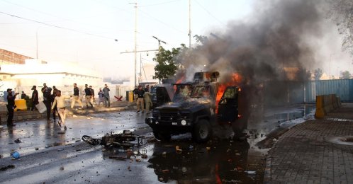 A burnt police vehicle is seen as protesters clash with security forces in Karachi, Pakistan, March 1, 2026. (EPA Photo)