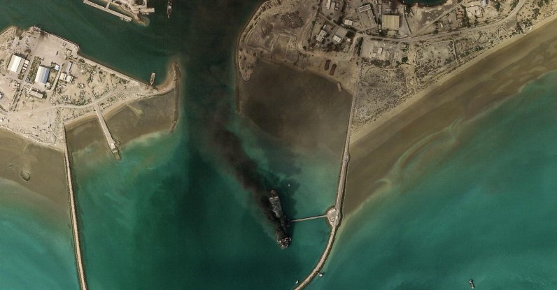 This handout satellite image taken by 2026 Planet Labs PBC shows smoke billowing from a vessel following an explosion from the port of Bandar Abbas along the strait of Hormuz, March 2, 2026. (AFP Photo)