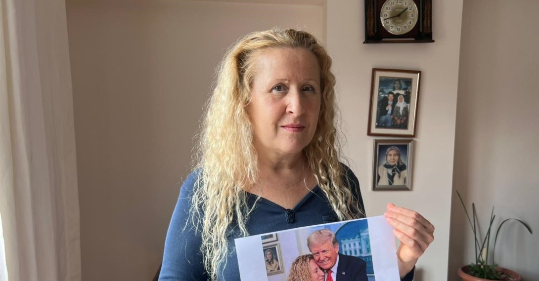 Necla Özmen holds an AI-generated image showing herself standing beside Donald Trump as she speaks publicly about her paternity claim, Ankara, Türkiye, March 1, 2026. (IHA Photo) 