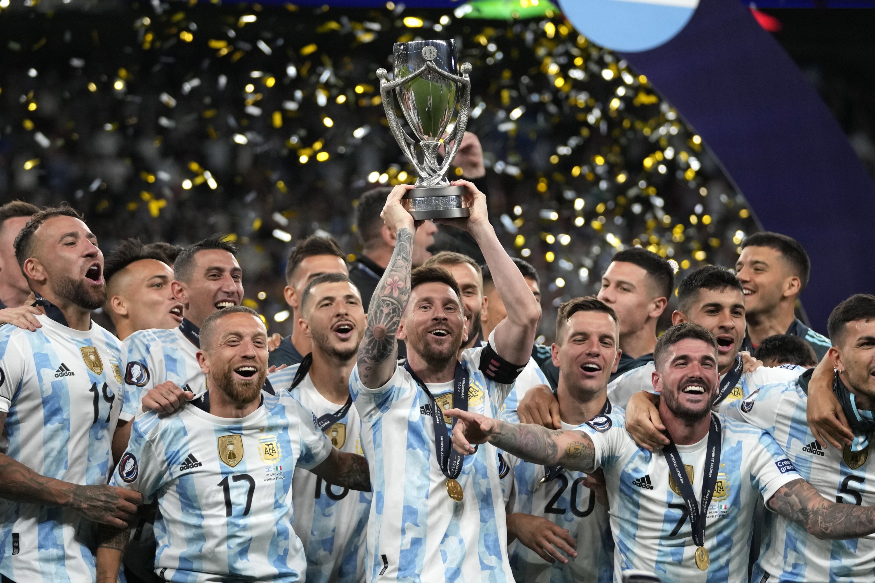 Argentina's Lionel Messi holds a trophy as he celebrates with teammates after winning the Finalissima match against Italy at Wembley Stadium, London, U.K., June 1, 2022. (AP Photo)