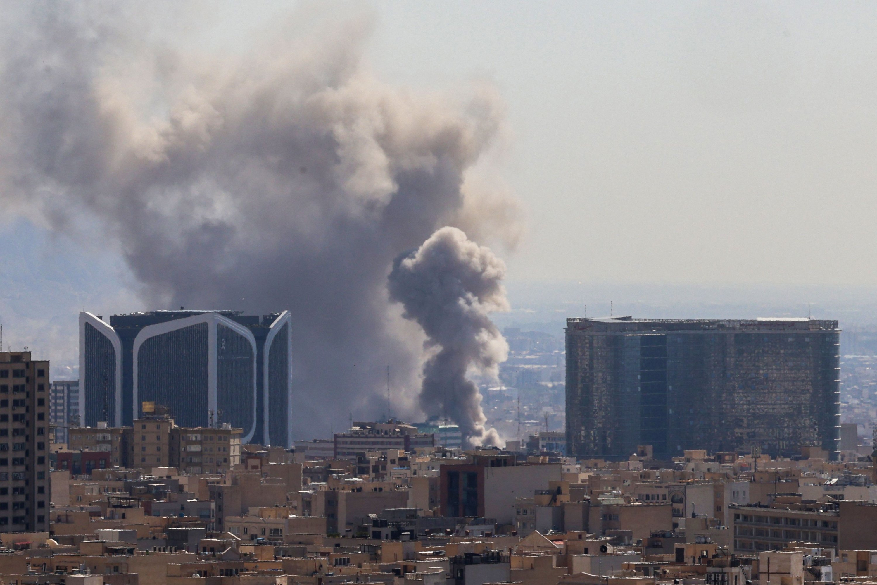 Plumes of smoke rise over Tehran as powerful explosions rock the Iranian capital amid ongoing U.S. and Israeli airstrikes, Tehran, Iran, March 1, 2026. (AFP Photo)