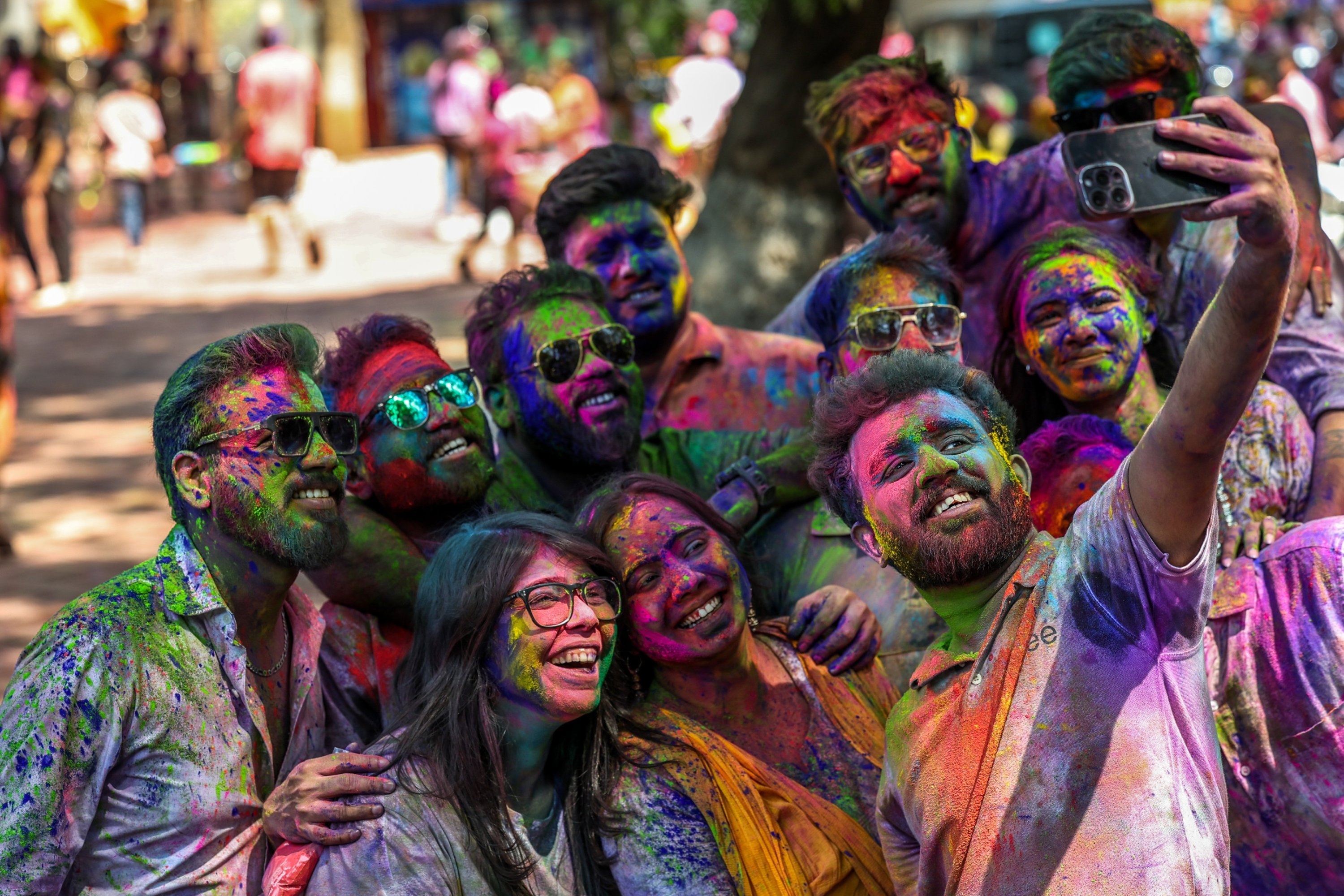 People with color-powder-stained faces attend a Holi festival celebration in Mumbai, India, March 3, 2026. (EPA Photo)