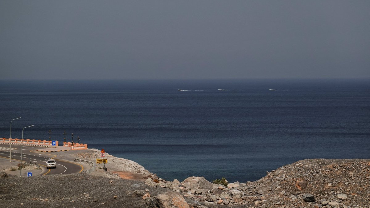 A car rides along the coast of Musandam overlooking the Strait of Hormuz amid the U.S.-Israeli conflict with Iran, Oman, March 2, 2026. (Reuters Photo)