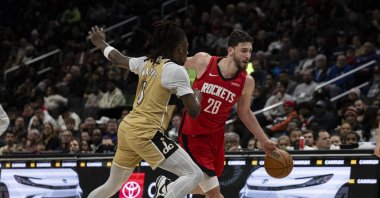 Houston Rockets center Alperen Şengün (R) battles opponents during the NBA game against the Washington Wizards at Capital One Arena, Washington, U.S., March 3, 2026. (AA Photo)
