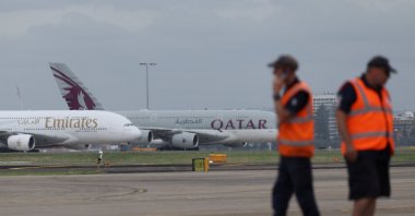 Emirates and Qatar Airways planes sit on the tarmac at Sydney Kingsford Smith Airport in Sydney, Australia, March 3, 2026. (Reuters Photo)