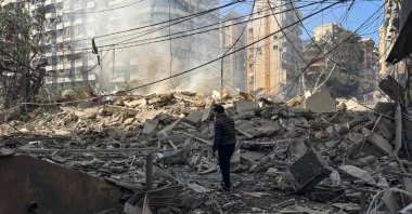 A man looks at the debris at a site of an Israeli airstrike in the southern suburbs of Beirut, Lebanon, March 3, 2026. (AFP Photo)