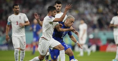 USMNT's Sergino Dest (R) fights for the ball with Iran's Milad Mohammadi during the World Cup group B match between Iran and the United States at the Al Thumama Stadium, Doha, Qatar, Nov. 29, 2022. (AP Photo)