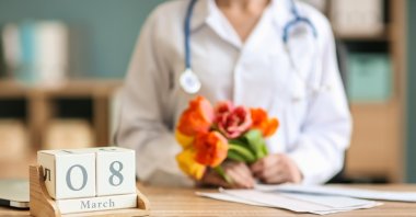 A calendar showing March 8 sits on a female doctor’s desk. (Shutterstock Photo)