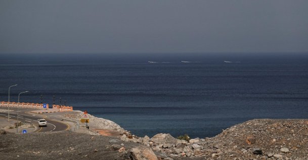 A car rides along the coast of Musandam overlooking the Strait of Hormuz amid the U.S.-Israeli conflict with Iran, Oman, March 2, 2026. (Reuters Photo)