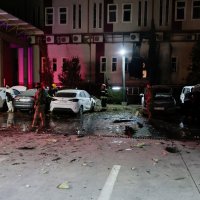 People gather near debris from a drone that fell onto a building near Irbil airport, amid the U.S.-Israeli conflict with Iran, in the Ankawa district of Irbil, Iraq, March 4, 2026. (Reuters Photo)