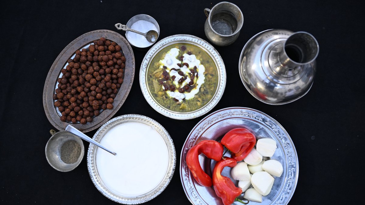 In this undated photo, traditional Turkish dish borani is served with yogurt on top, with its ingredients displayed nearby, southeastern Türkiye, Şanlıurfa. (AA Photo)
