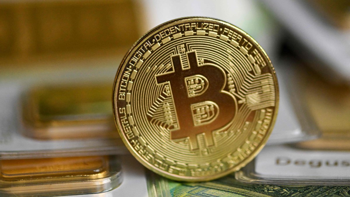 A commemorative bitcoin coin is seen in Dortmund, western Germany, Feb. 9, 2026. (AFP Photo)