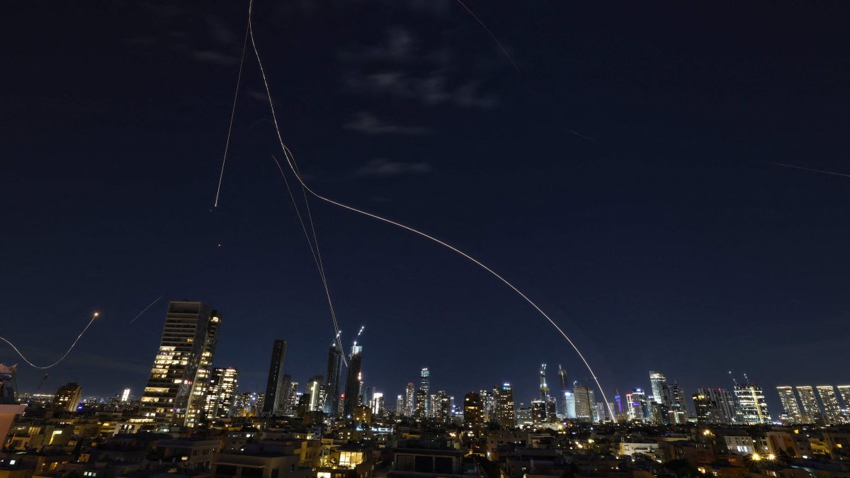 Rocket trails from an interception by the Iron Dome missile defense system are pictured over Tel Aviv, Israel, March 1, 2026. (AFP Photo)