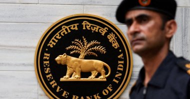 A man walks past the Reserve Bank of India (RBI) logo outside its headquarters, Mumbai, India, June 6, 2025. (Reuters Photo)