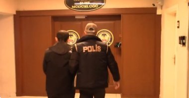 Police officers escort a Daesh suspect, Ankara, Türkiye, March 4. 2026. (DHA Photo)