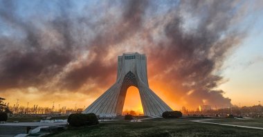 Smoke rises up behind Azadi, or freedom tower, following a U.S.-Israeli military strike, Tehran, Iran, March 3, 2026. (AP Photo)