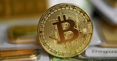 A commemorative bitcoin coin is seen in Dortmund, western Germany, Feb. 9, 2026. (AFP Photo)