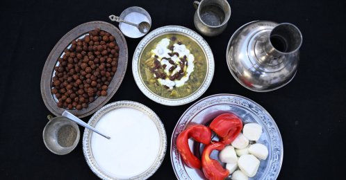 In this undated photo, traditional Turkish dish borani is served with yogurt on top, with its ingredients displayed nearby, southeastern Türkiye, Şanlıurfa. (AA Photo)