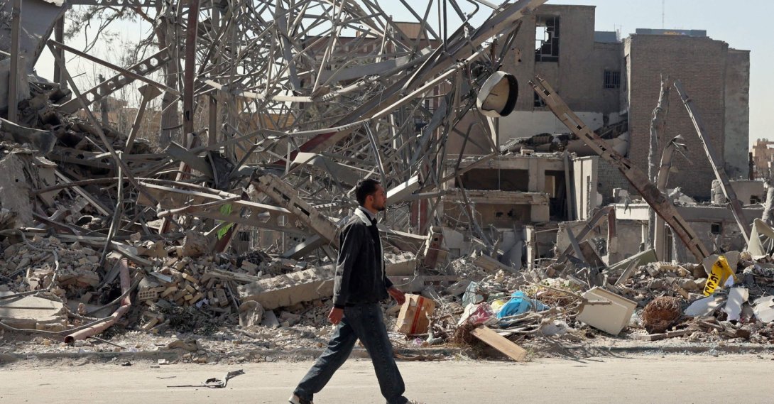 A man walks past destroyed buildings following airstrikes in central Tehran, Iran, March 4, 2026. (AFP Photo)