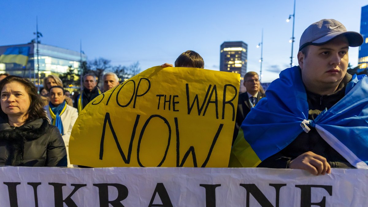 People gather during a demonstration marking the fourth anniversary of Russia’s full-scale invasion of Ukraine at Place des Nations, in front of the U.N. headquarters, Geneva, Switzerland, Feb. 24, 2026. (EPA Photo)