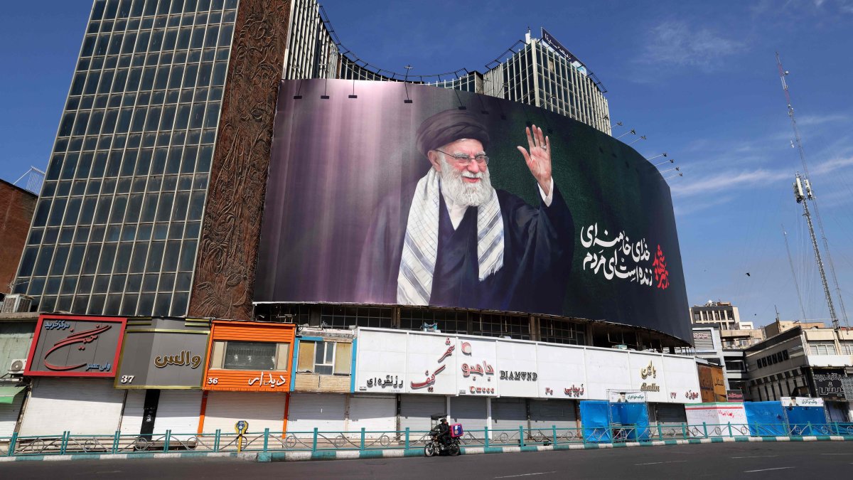 A billboard with a picture of Iran's late Supreme Leader Ayatollah Ali Khamenei is seen installed on a building at Valiasr Square, Tehran, Iran, March 5, 2026. (AFP Photo)