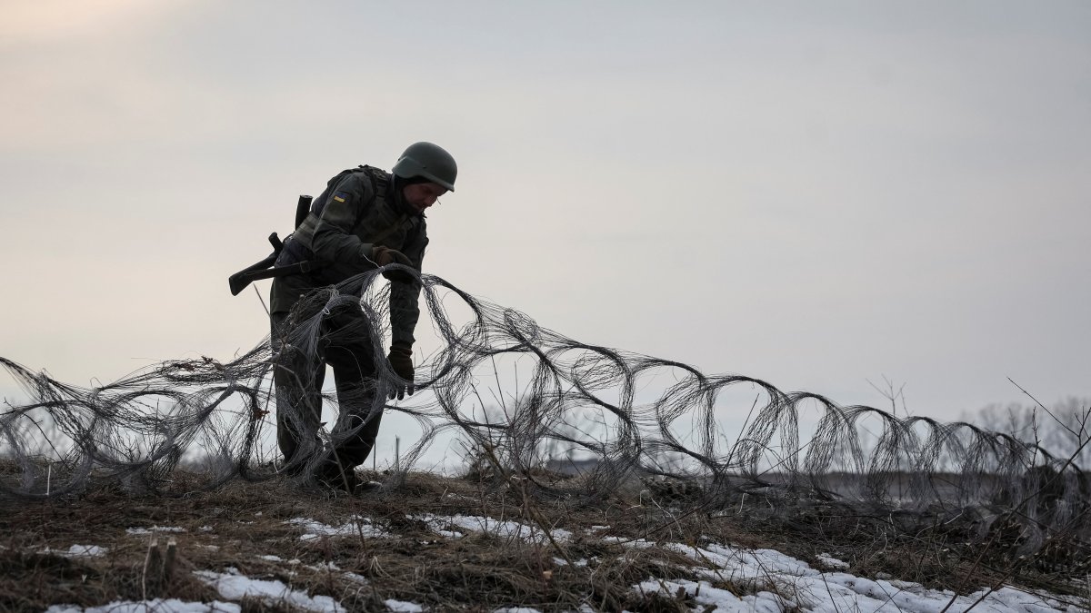 A Ukrainian serviceman installs an inconspicuous wire barrier near a front line in Kupiansk, in Kharkiv region, Ukraine, March 2, 2026. (Reuters Photo)