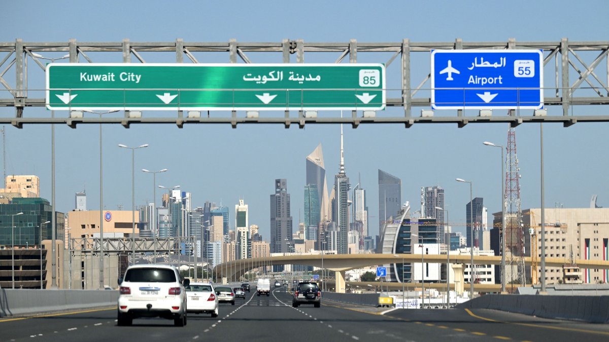 Vehicles drive along the highway leading to and from Kuwait City, March 2, 2026. (AFP Photo)
