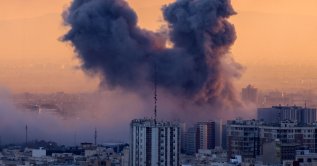 A plume of smoke rises after a strike on the Iranian capital Tehran, Iran, March 3, 2026. (AFP Photo)
