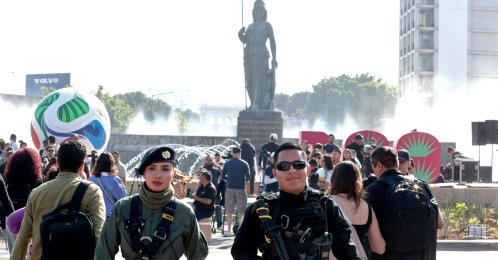 Two police officers guard the area after a giant football and a 3D sign with the number 100 were installed at the roundabout where the "La Minerva" statue stands, as part of the 100 days leading up to the 2026 FIFA World Cup, Guadalajara, Jalisco, Mexico, March 3, 2026. (AFP Photo)