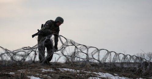 A Ukrainian serviceman installs an inconspicuous wire barrier near a front line in Kupiansk, in Kharkiv region, Ukraine, March 2, 2026. (Reuters Photo)