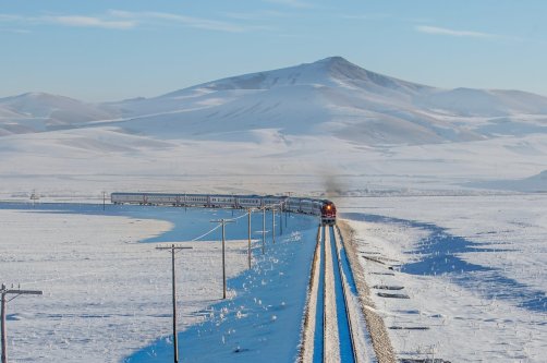 The Tourist Eastern Express travels through a scenic winter landscape, Kars, Türkiye, Nov. 30, 2024. (Shutterstock Photo)