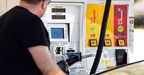 A man pumps gasoline into his vehicle at a gas station in Los Angeles, California, U.S., March 2, 2026. (AFP Photo)