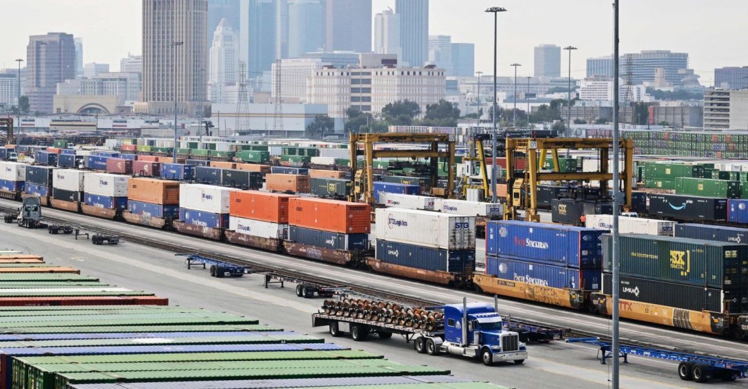 The downtown Los Angeles skyline is seen behind shipping containers at the LATC-Union Pacific Los Angeles Transportation Center rail yard, Los Angeles, California, U.S., Feb. 24, 2026. (AFP Photo)