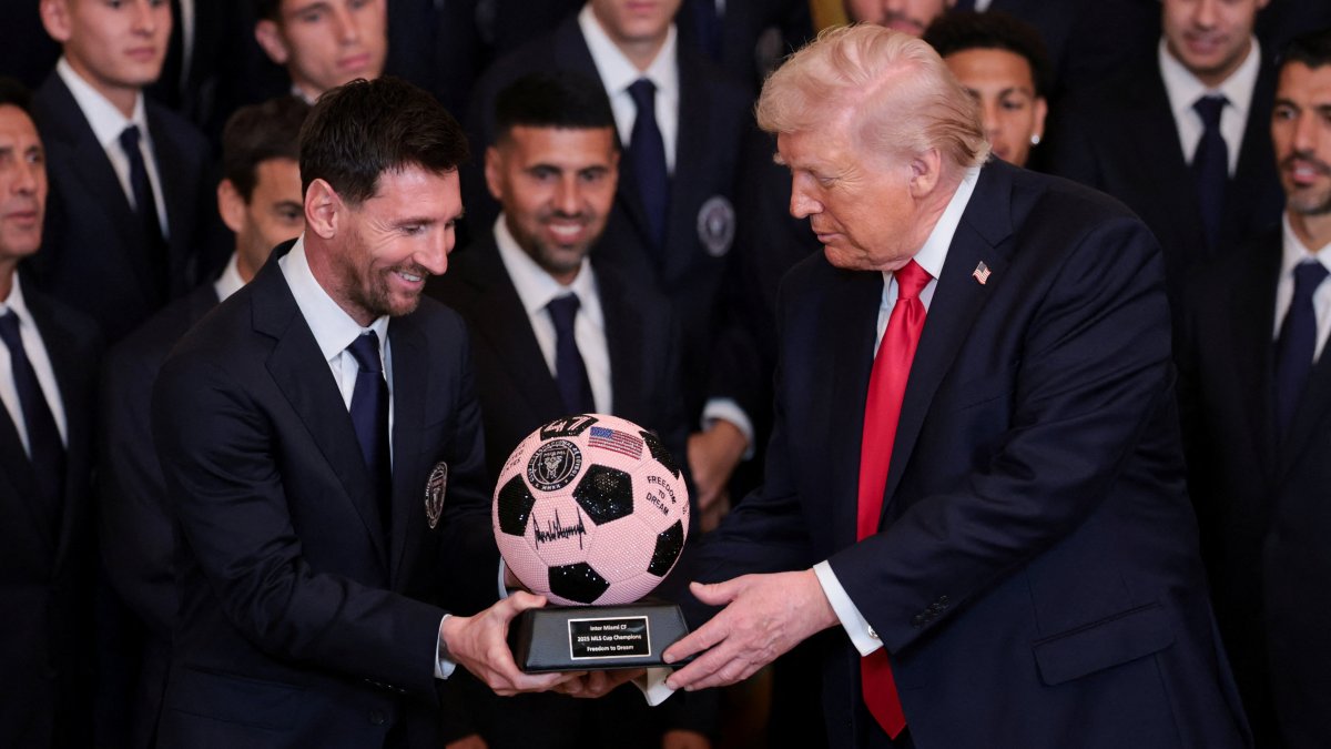 U.S. President Donald Trump (R) is gifted a jewelled football ball with his signature on it from Inter Miami CF captain Lionel Messi, on the day he honors reigning Major League Soccer (MLS) champion Inter Miami CF players and team officials with an event in the East Room of the White House, Washington, U.S., March 5, 2026. (Reuters Photo)