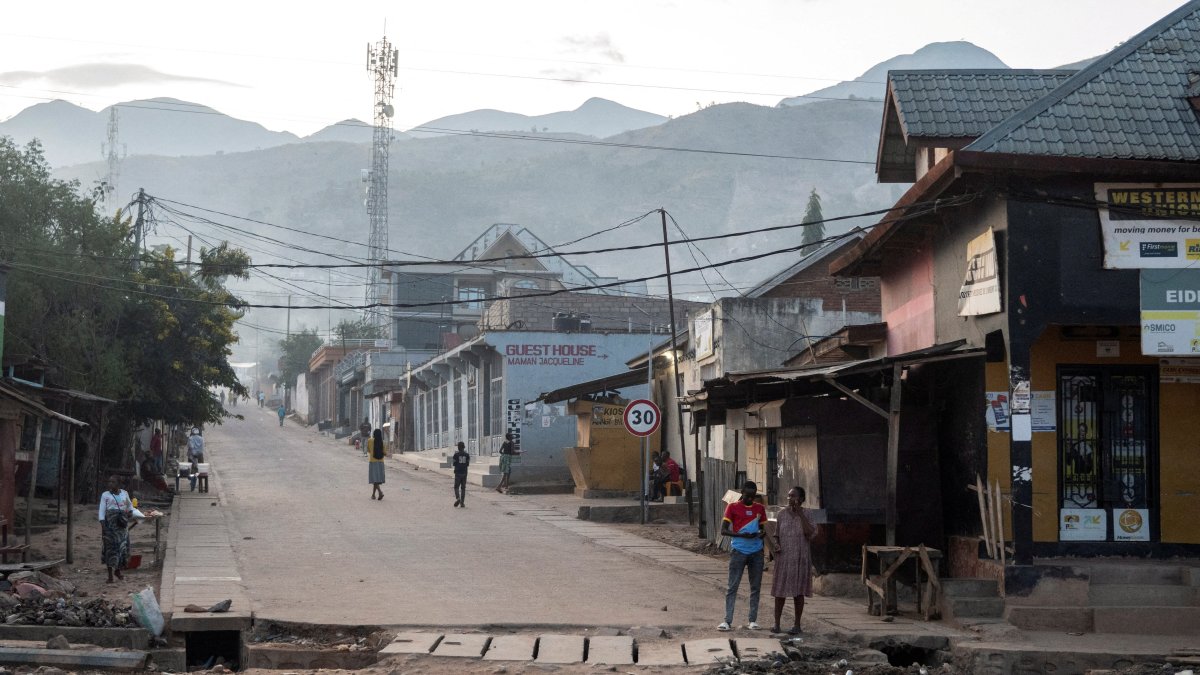 Congolese civilians walk after returning to their homes following displacement during renewed clashes between Alliance Fleuve Congo AFC/M23 and the Armed Forces of the Democratic Republic of the Congo (FARDC), Uvira town, DRC, Dec. 13, 2025. (Reuters Photo)