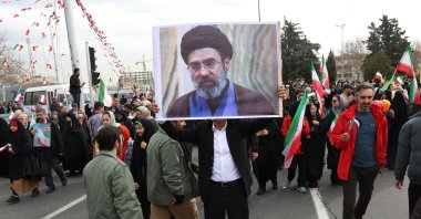 An Iranian man holds a picture of Mojtaba Khamenei, the son of the Iranian Supreme Leader, as he takes part in celebrations of the 47th anniversary of the Islamic Revolution, Tehran, Iran, Feb. 11, 2026. (EPA Photo)