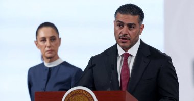 Mexico's Secretary of Security and Citizen Protection Omar Garcia Harfuch speaks next to President Claudia Sheinbaum during a press conference at the National Palace, Mexico City, Mexico, Nov. 3, 2025. (Reuters Photo)