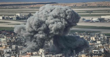 Smoke rises from the site of an Israeli airstrike that targeted a neighbourhood in Beirut’s southern suburbs, with the city's international airport visible in the background, Lebanon, March 4, 2026. (AFP Photo)