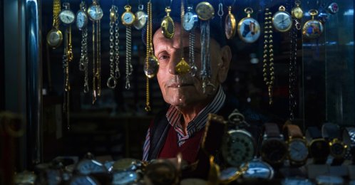 Arif Kocaman looks at his collection of watches in his shop, Istanbul, Türkiye, Feb. 10, 2026. (AA Photo)