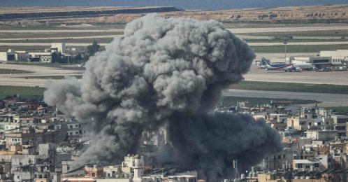Smoke rises from the site of an Israeli airstrike that targeted a neighbourhood in Beirut’s southern suburbs, with the city's international airport visible in the background, Lebanon, March 4, 2026. (AFP Photo)