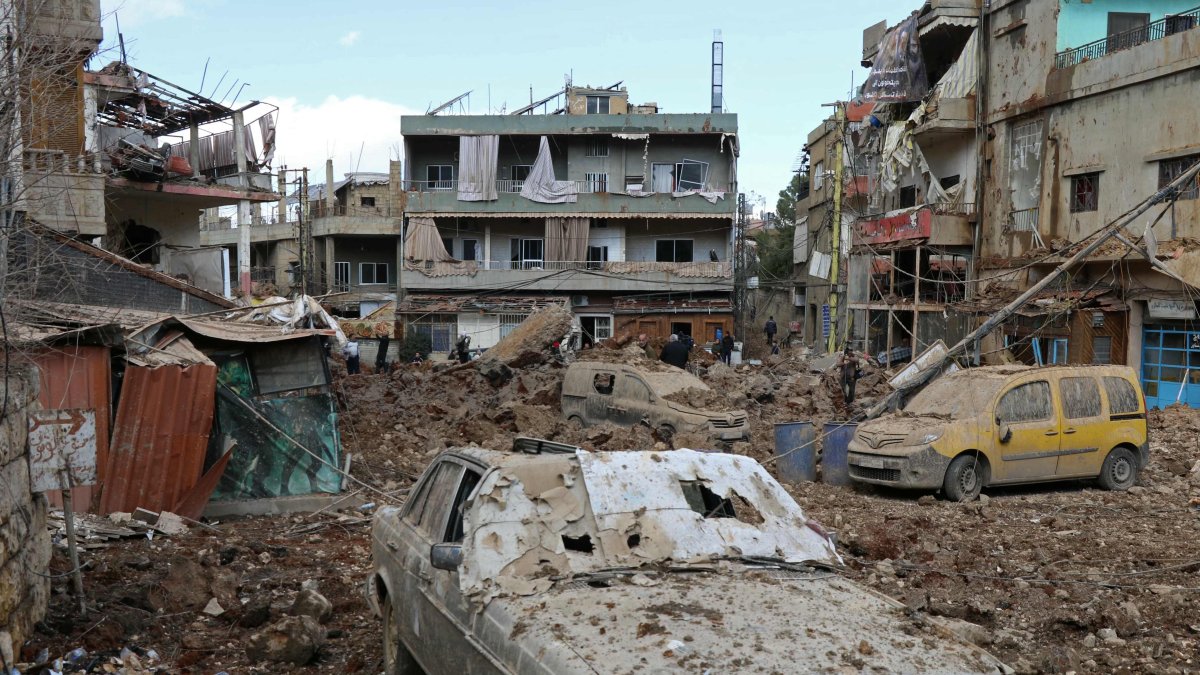 This photograph taken during a media tour organised by the Hezbollah shows people inspecting the destruction at Nabi Sheet town after an Israeli military operation in the Bekaa Valley, Lebanon, March 7, 2026. (AFP Photo)