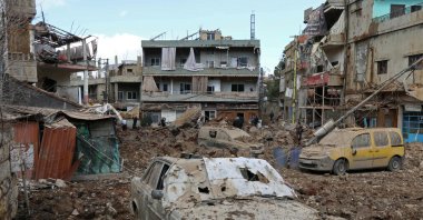 This photograph taken during a media tour organised by the Hezbollah shows people inspecting the destruction at Nabi Sheet town after an Israeli military operation in the Bekaa Valley, Lebanon, March 7, 2026. (AFP Photo)