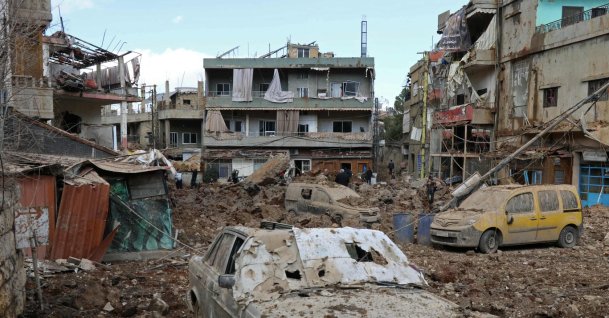 This photograph taken during a media tour organised by the Hezbollah shows people inspecting the destruction at Nabi Sheet town after an Israeli military operation in the Bekaa Valley, Lebanon, March 7, 2026. (AFP Photo)